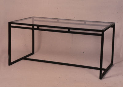 ARMED GLASS TABLE. 1972